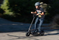 Man riding Boosted Rev