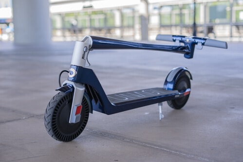 Blue Unagi Model One electric scooter in folded configuration