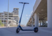 Unagi Model One electric scooter near bridge