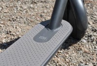 Xiaomi electric scooter deck has a grey rubberized finish