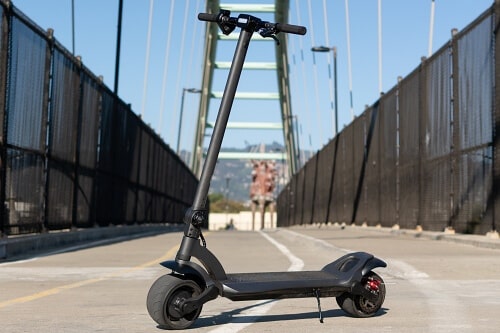 Mercane electric scooter on pedestrian bridge
