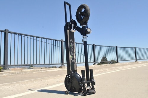Glion Dolly electric scooter folded and standing upright