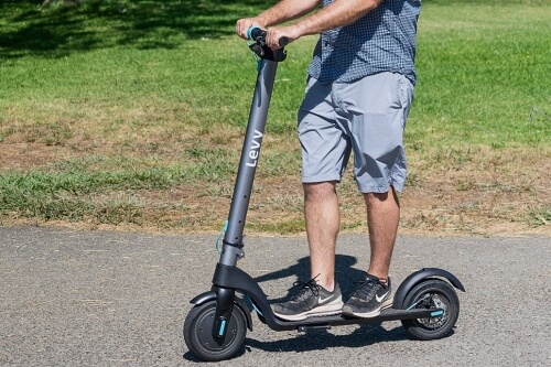 Man riding Levy electric scooter