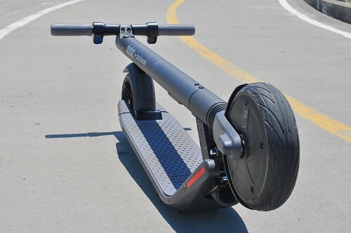 Segway ES2 electric scooter folded in a road