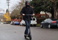 Man accelerating on the Swift electric scooter