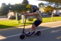 Man riding the M365 Pro electric scooter