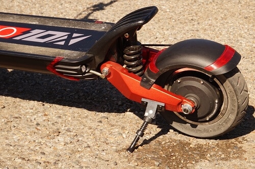 Close up of the Zero 10X's rear suspension and wheel