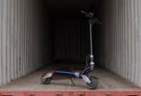 8X electric scooter in a shipping container