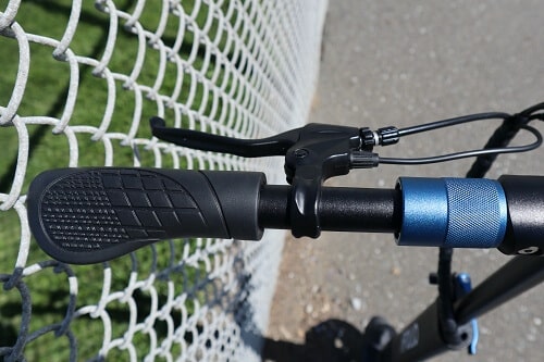 Close up of electric scooter handlebars and brake lever