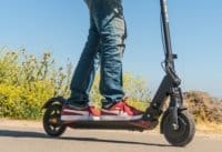 Man riding the E-TWOW GT electric scooter