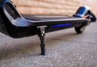 Hhiboy Max V2 electric scooter deck lighting (blue) and kickstand, low angle shot