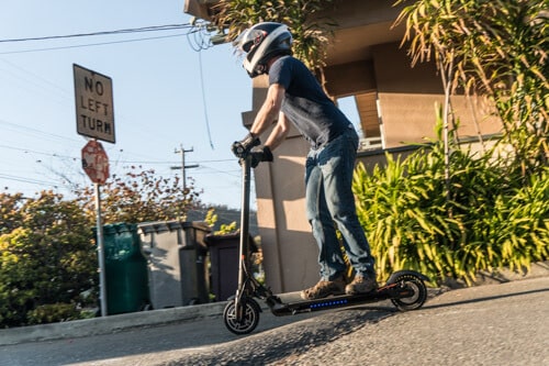 Man riding Hiboy Max V2 electric scooter downhill in Albany, CA