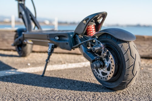 Kaabo-Mantis-8-electric-scooter-rear-view-low-angle-rear-tire-and-kickstand-and-deck