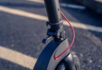 TurboAnt X7 Pro Electric Scooter -folding mechanism on stem, clasp open, close-up