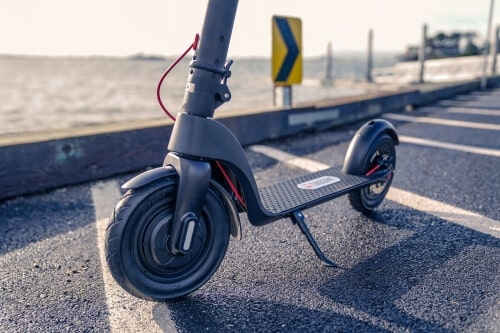 TurboAnt X7 Pro Electric Scooter - front tire, deck, rear tire, and kickstand, cropped view