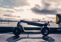TurboAnt X7 Pro Electric Scooter -full scooter, folded down and hooked to fender