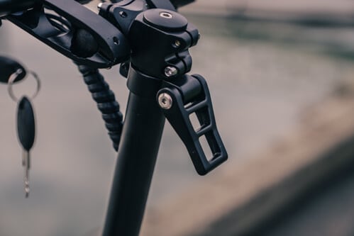 Apollo Ghost electric scooter - folding latch on stem, close-up