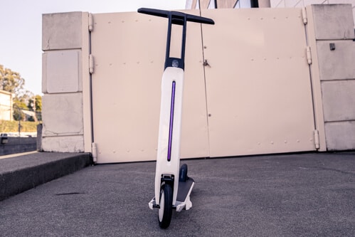 Segway Ninebot Air T15 electric scooter - full scooter, front view, stem light on, limited view