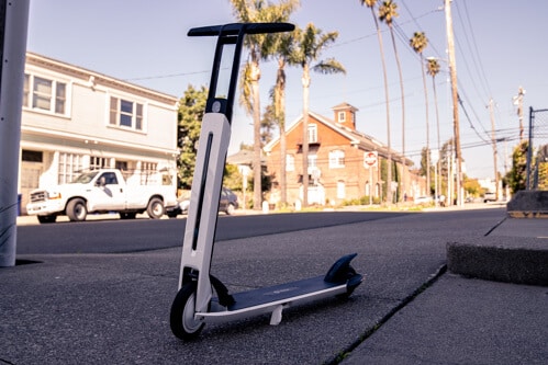Segway Ninebot Air T15 electric scooter - full scooter, stem to left, building in background