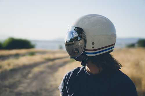 Man wearing helmet, looking to side