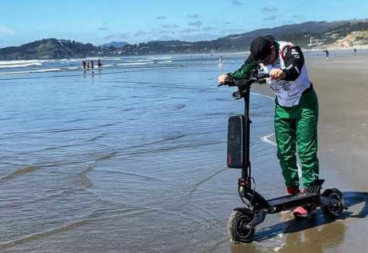 Alex Simon reaching Pacific Ocean with electric scooter