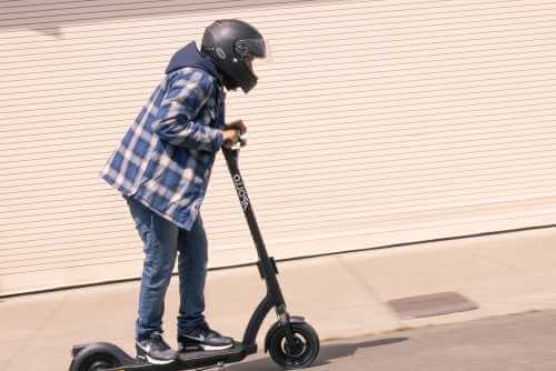 Apollo Air Pro electric scooter - man riding, looks uphill