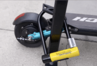 Splach Turbo electric scooter locked to pole, close-up