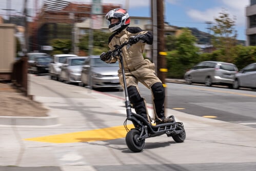 NAMI BURN-E electric scooter - man riding around corner