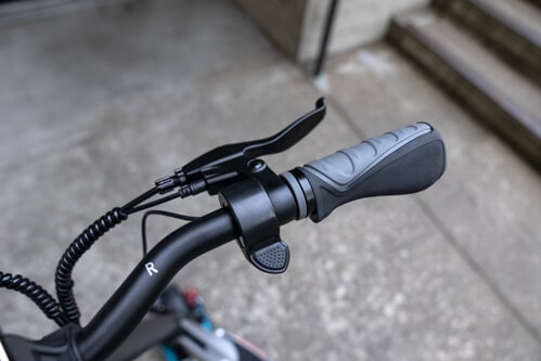 Close up of Pegasus electric scooter thumb throttle and controls