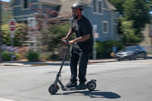 Heavier, bigger man riding the Hiboy S2 electric scooter