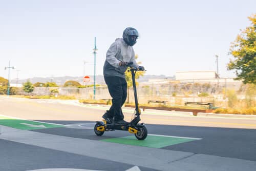 Man riding the VSETT 10+ electric scooter