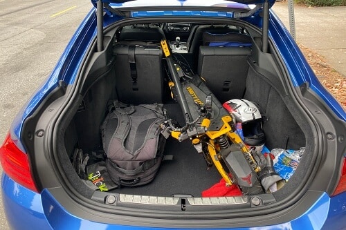 VSett 10+ electric scooter inside of a compact car trunk
