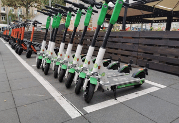Lime shared scooters parked in a row