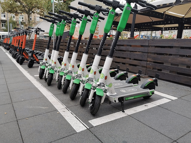 Lime shared scooters parked in a row